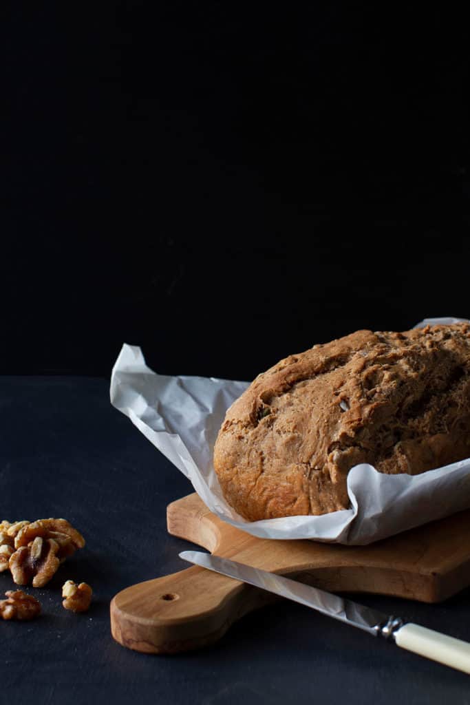 A simple spelt bread loaf on a wooden board