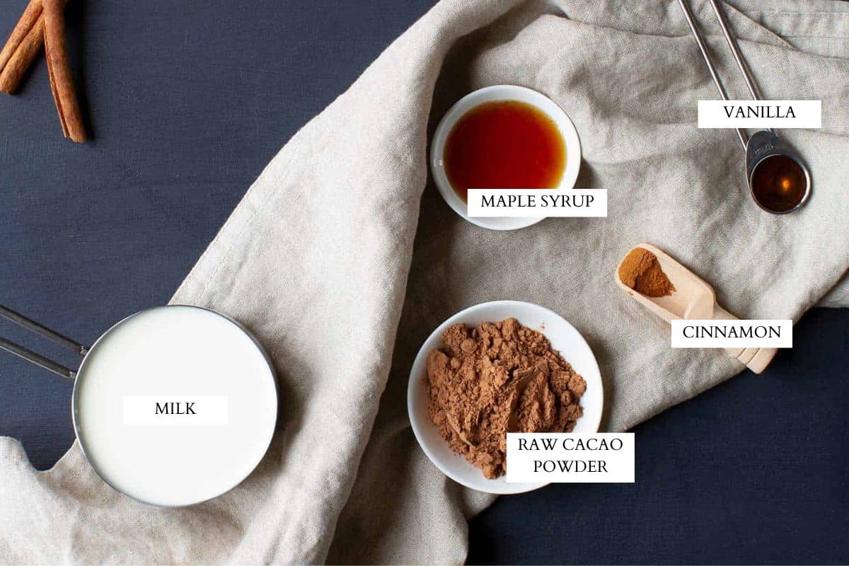 Ingredients laid out to make a hot cacao drink.