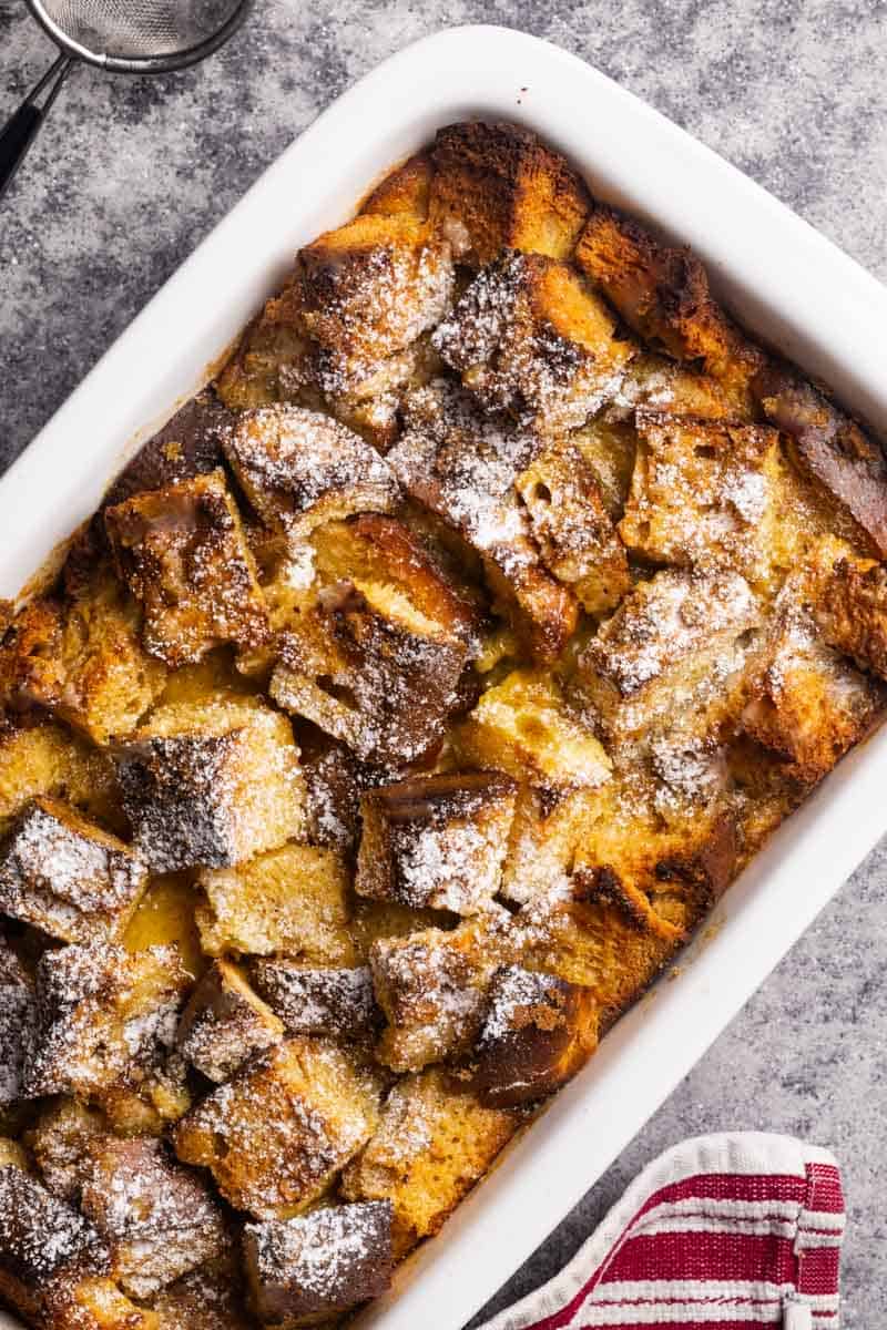 Baked French toast with brioche in a casserole dish.