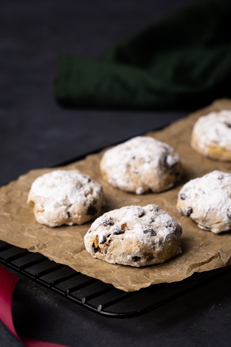 A tray of stollen cookies next to a napkin.