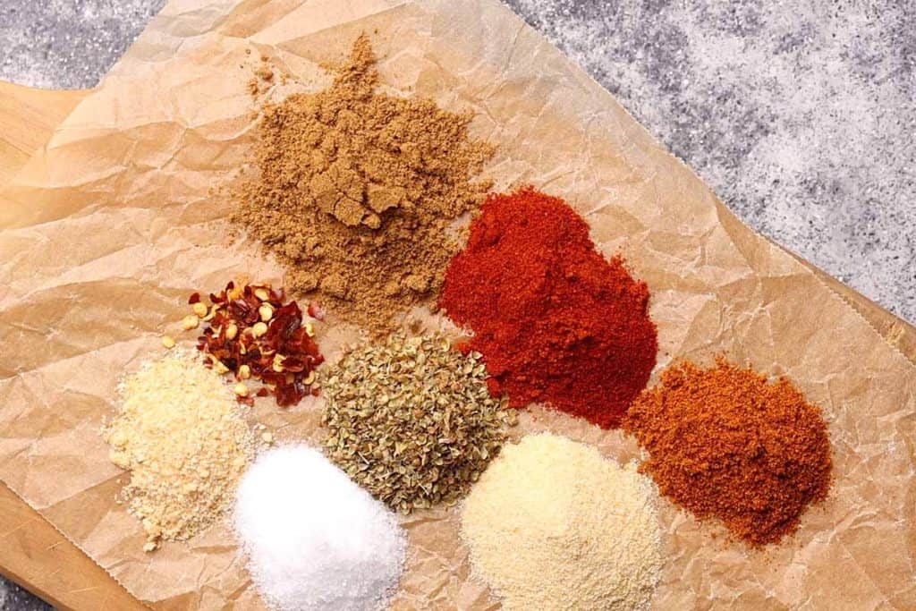 Chicken taco seasoning ingredients on a baking sheet.