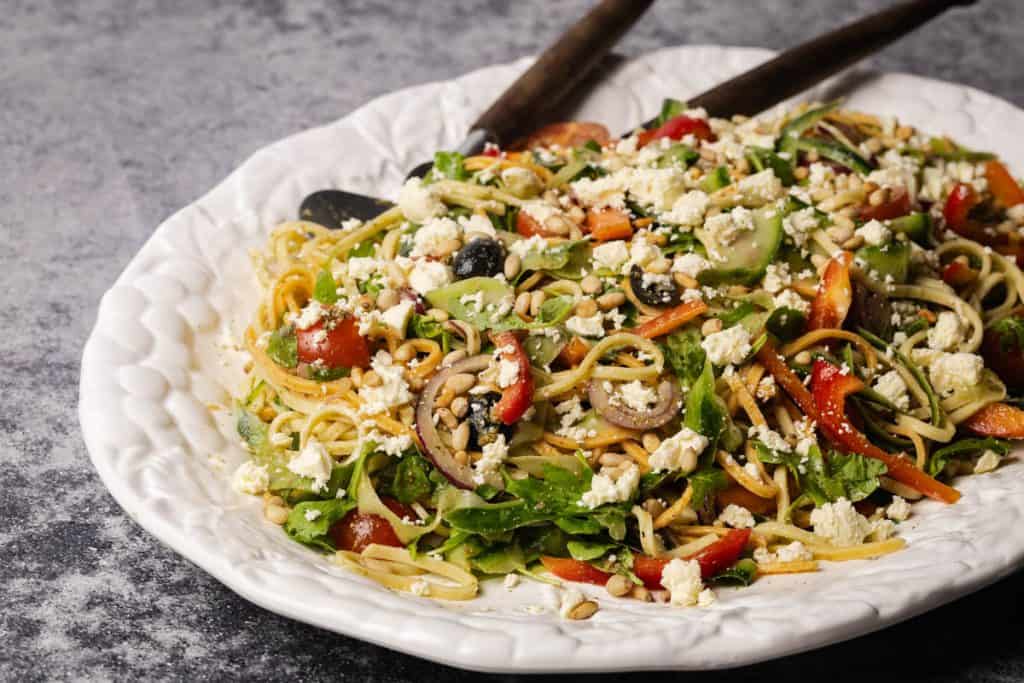 Linguine salad on a large white serving platter.