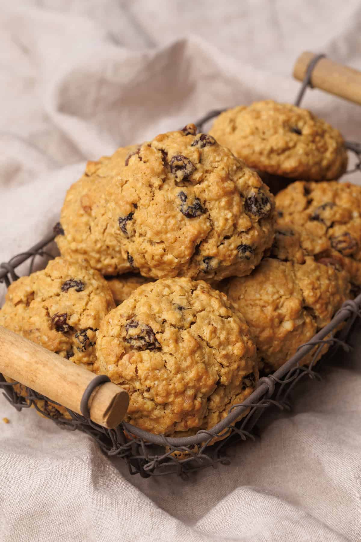 A wire basket filled with energy cookies on a linen cloth.