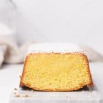 Vanilla pound cake on a marble tray, white background.