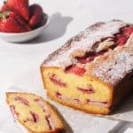Strawberry cake on a marble tray.