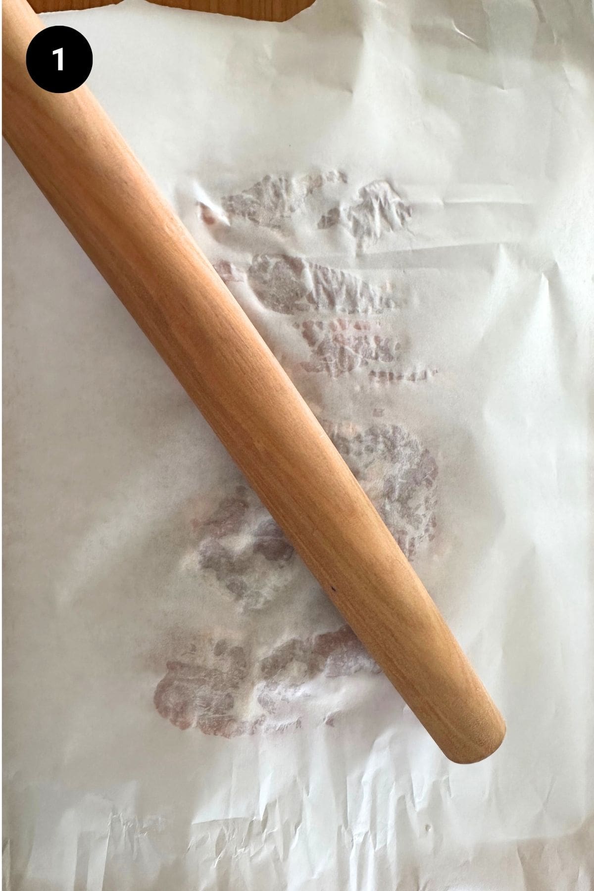 Butterflied lamb leg being flattened.