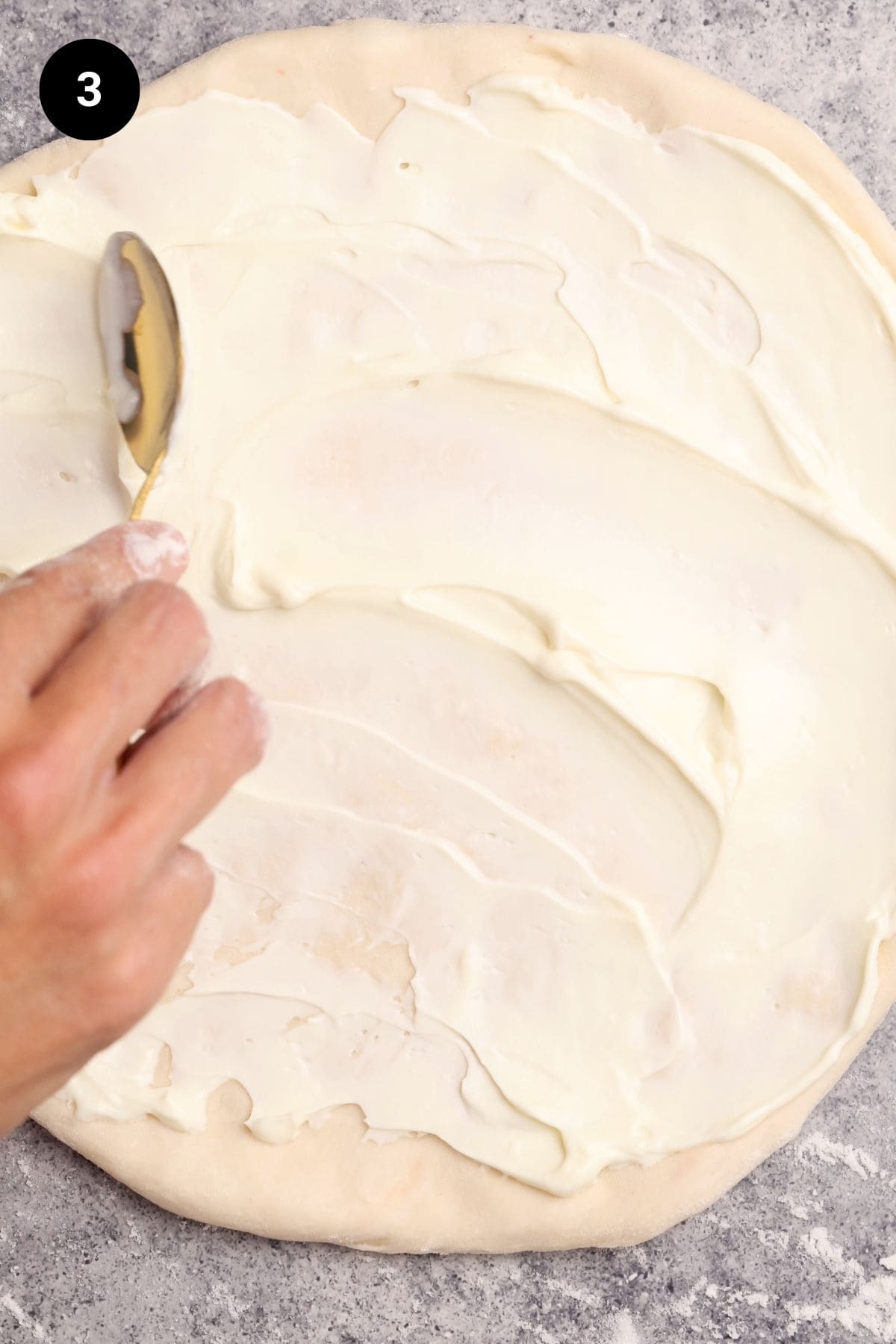Sour cream is added to the pizza dough.