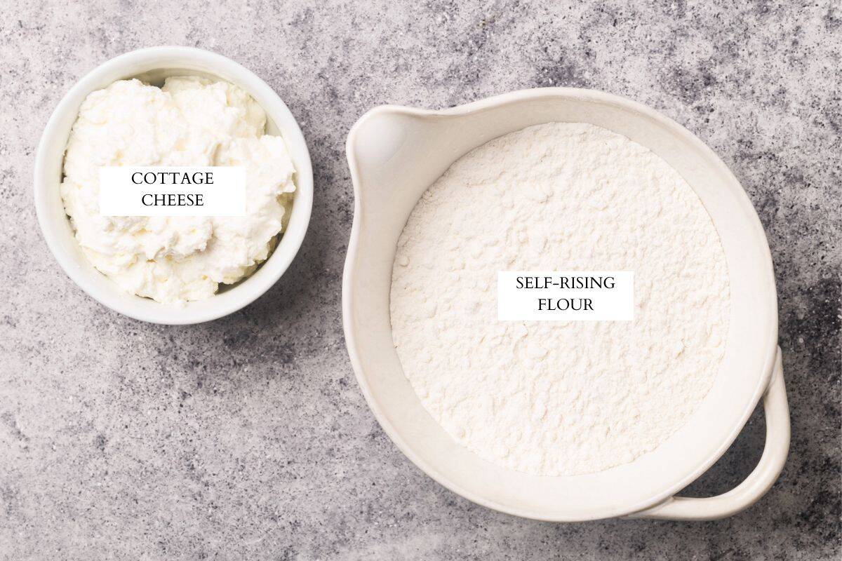 A bowl of flour and another on with cottage cheese.