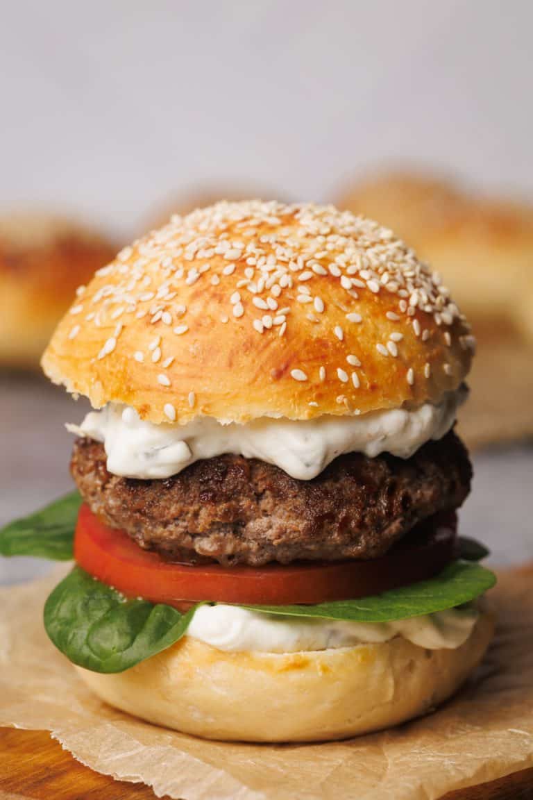 Hamburger on a wooden board.