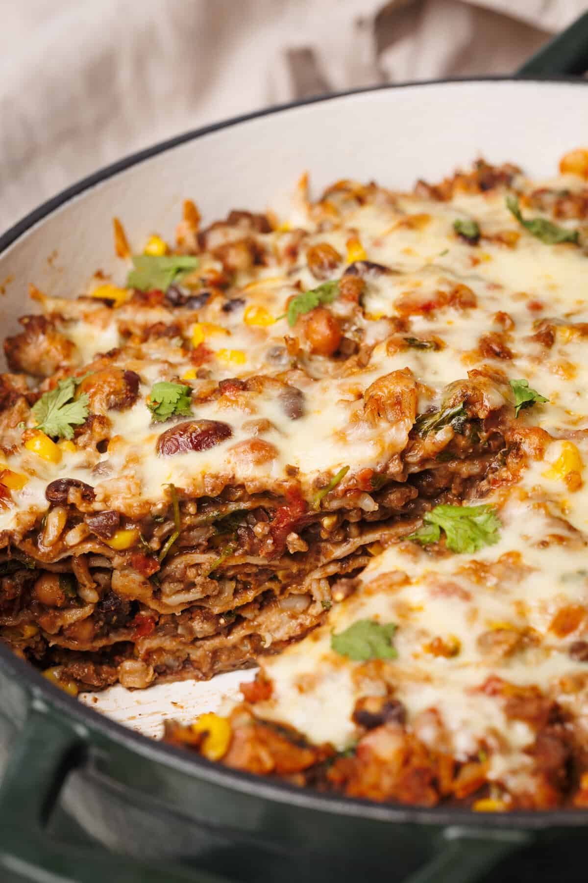 Close-up view of the Mexican Lasagna with a slice taken out of it.