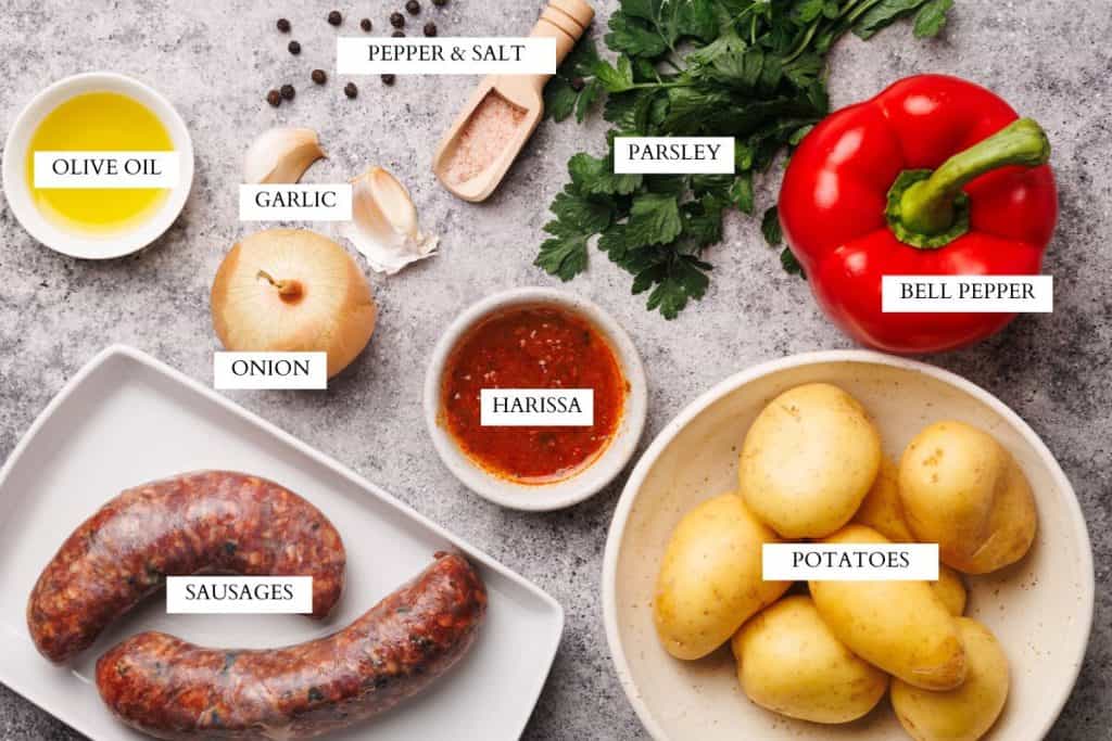 Ingredients laid out to make a spicy sausage and potato hash.
