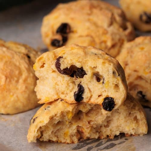 Spiced Fruit Bread Rolls on parchment paper.