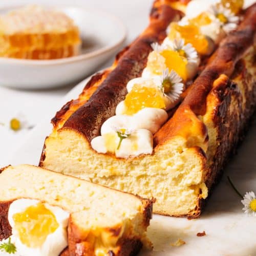 Honey Basque cheesecake on a marble board.
