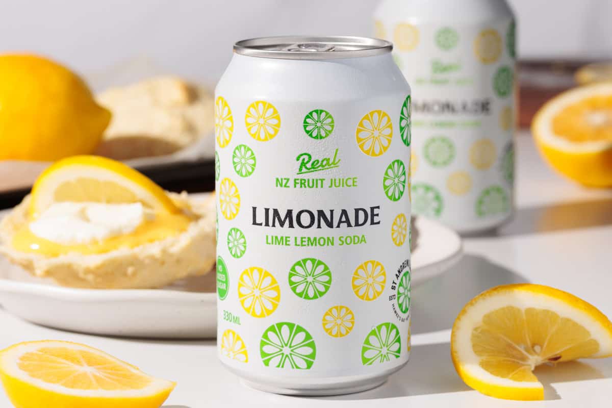 Lemonade can in front of some scones.