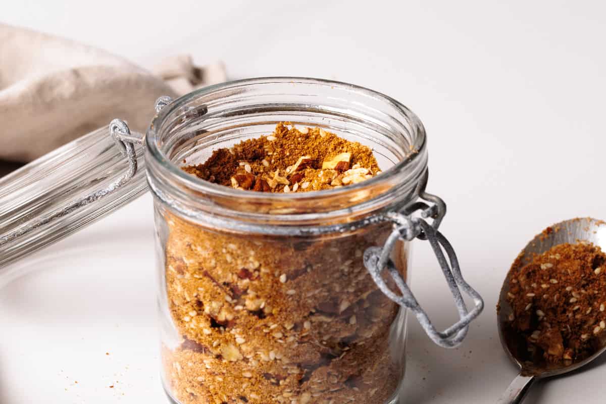 Sweet dukkah in a glass jar.