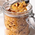 Sweet dukkah in a glass jar.
