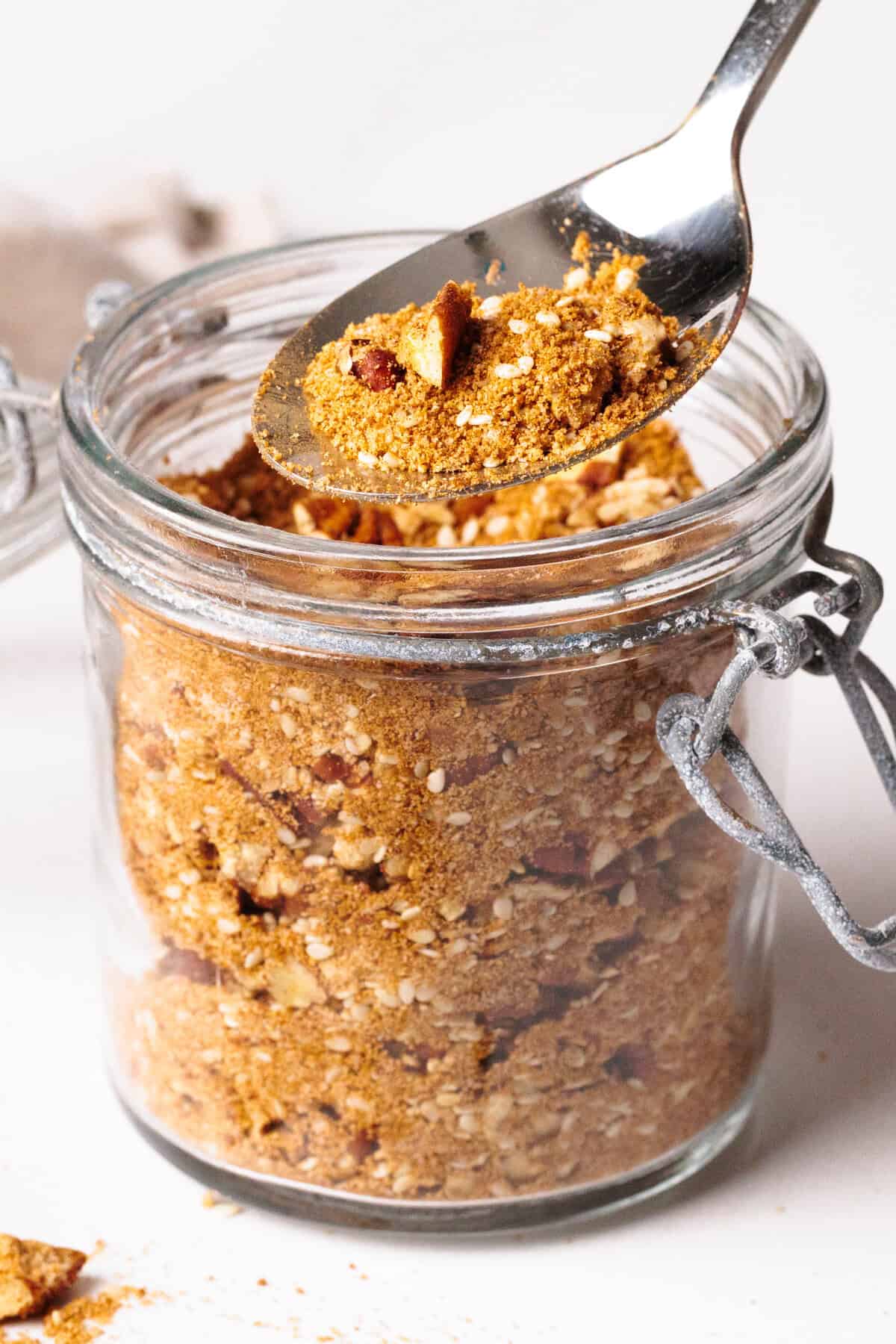Sweet dukkah in a glass jar.